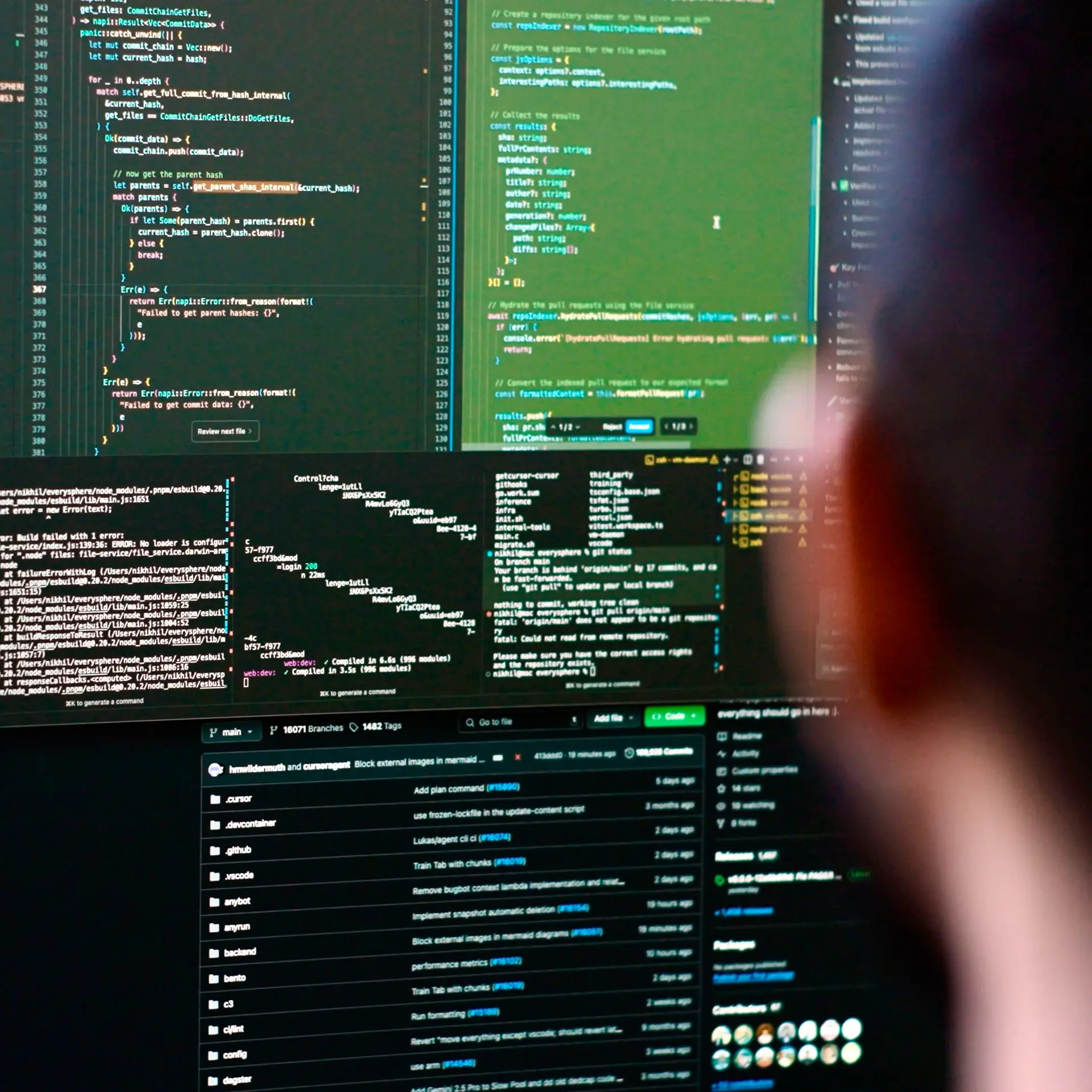 A person sitting in front of multiple screens